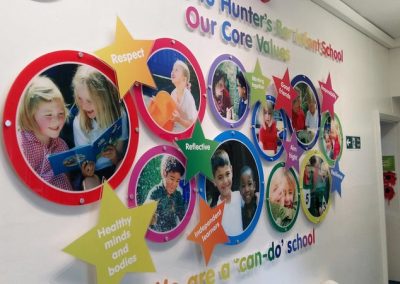 Core values display with custom wall art highlighting a school's mission and values