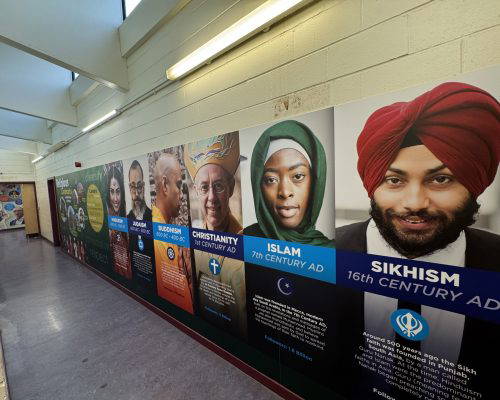 School wall art featuring wall murals of diverse religions. Bespoke classroom wall displays. Designed, manufactured and installed by Design for Education