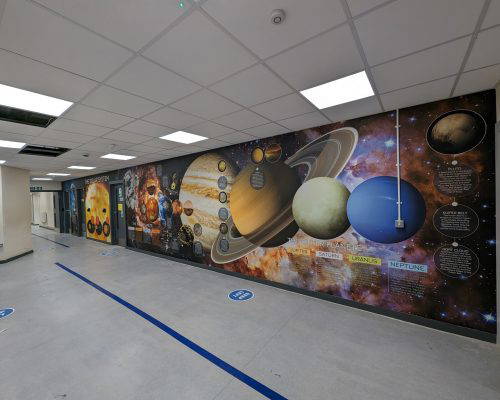 Corridor wall art showing the solar system and planets. Designed, installed and manufactured by Design for Education.