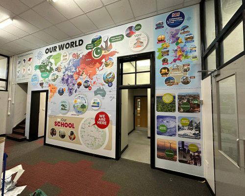 our-word-geography-world-map Bespoke school wall art featuring a world map and landmarks. Designed, manufactured and installed by Design for Education