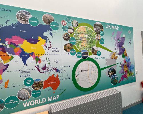 uk-map-school-mural-bespoke-design Bespoke school wall art featuring a world map and UK map. Designed, manufactured and installed by Design for Education