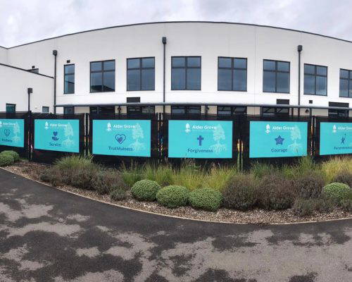 Outdoor School Values Mural Outdoor school values wall art, featuring 'Kindness', 'Service' and 'Truthfulness'. Designed, manufactured and installed by Design for Education.