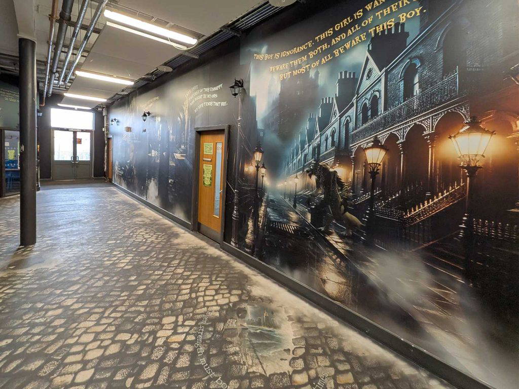 Dickensian English mural Victorian street transforming secondary school corridor