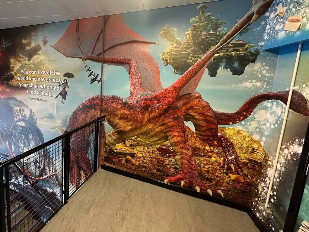 Space themed upper stairwell section of fantasy library mural inspired by fantasy novels