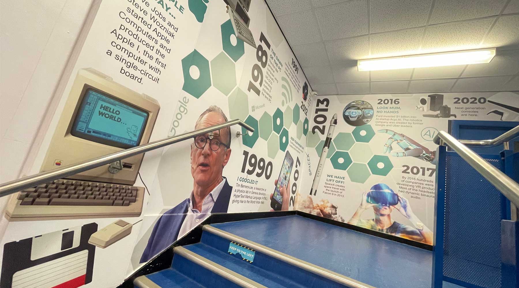 computer science wall art timeline installed in secondary school stairwell