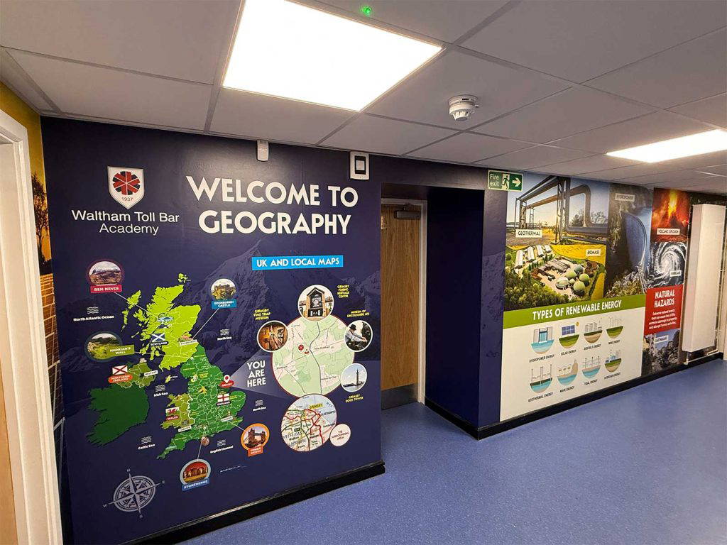 Immersive corridor displays in a secondary school featuring bespoke geography wall art and maps.