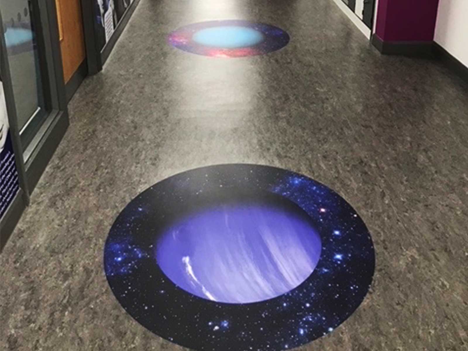 Immersive solar system floor graphics complementing science wall art