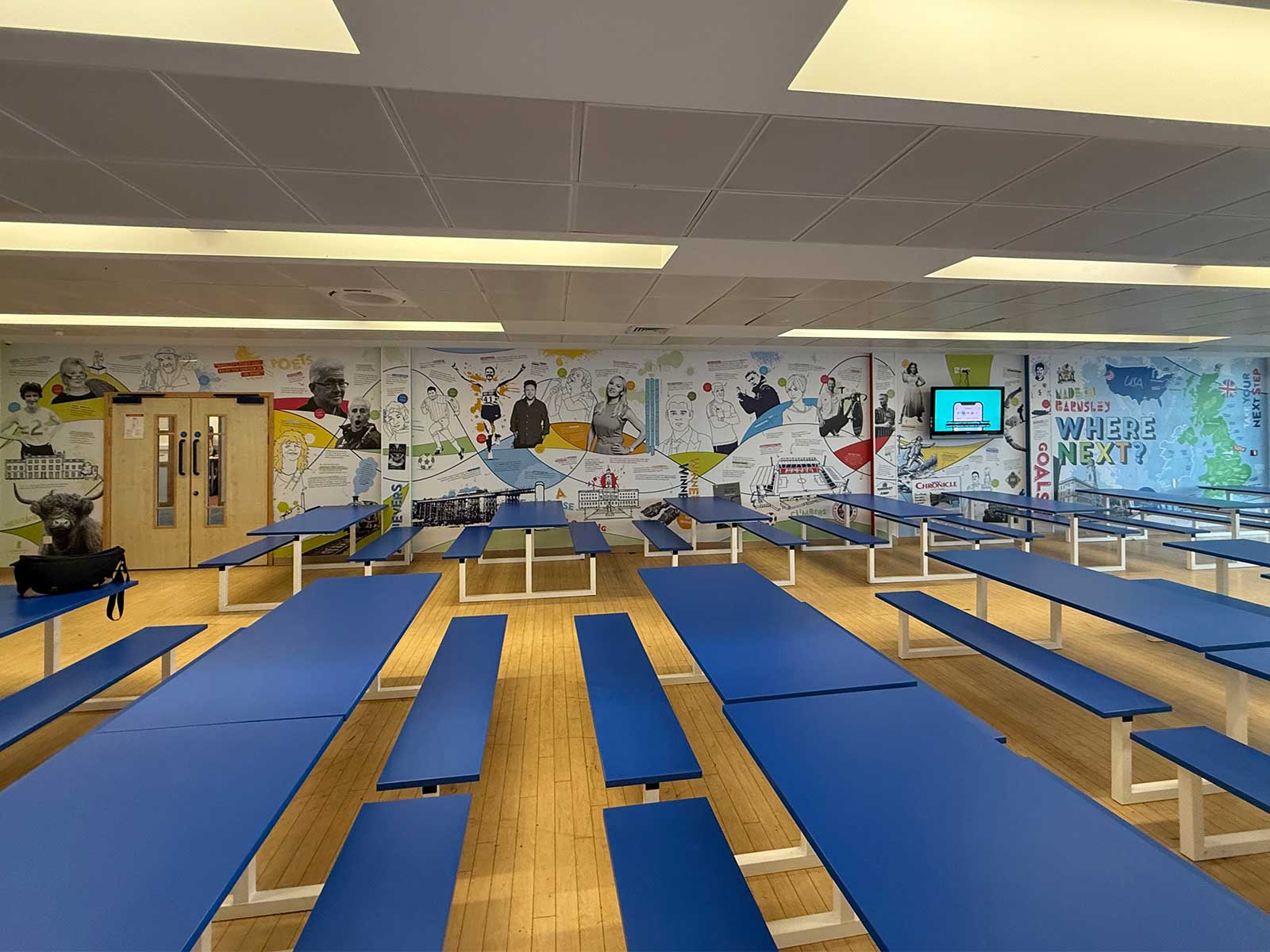 Educational wall art creating an inspiring secondary school dining space