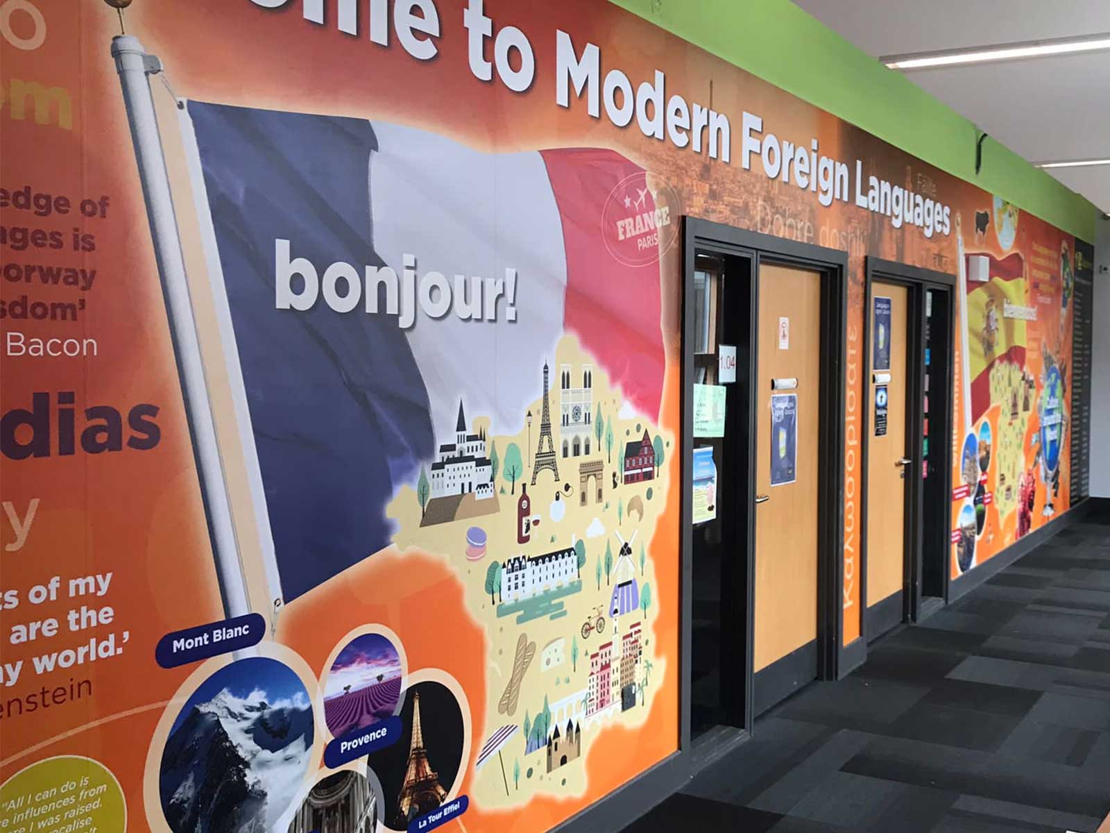 Secondary school corridor with inspirational languages wall graphics and educational wall art