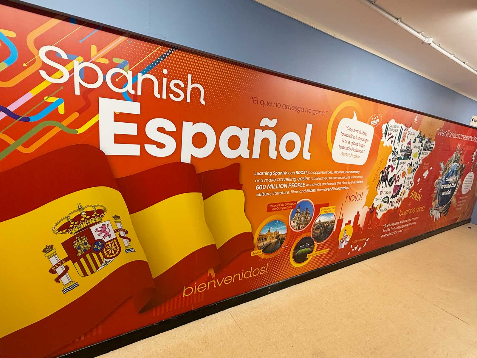 Spanish culture educational wall art in secondary school corridor